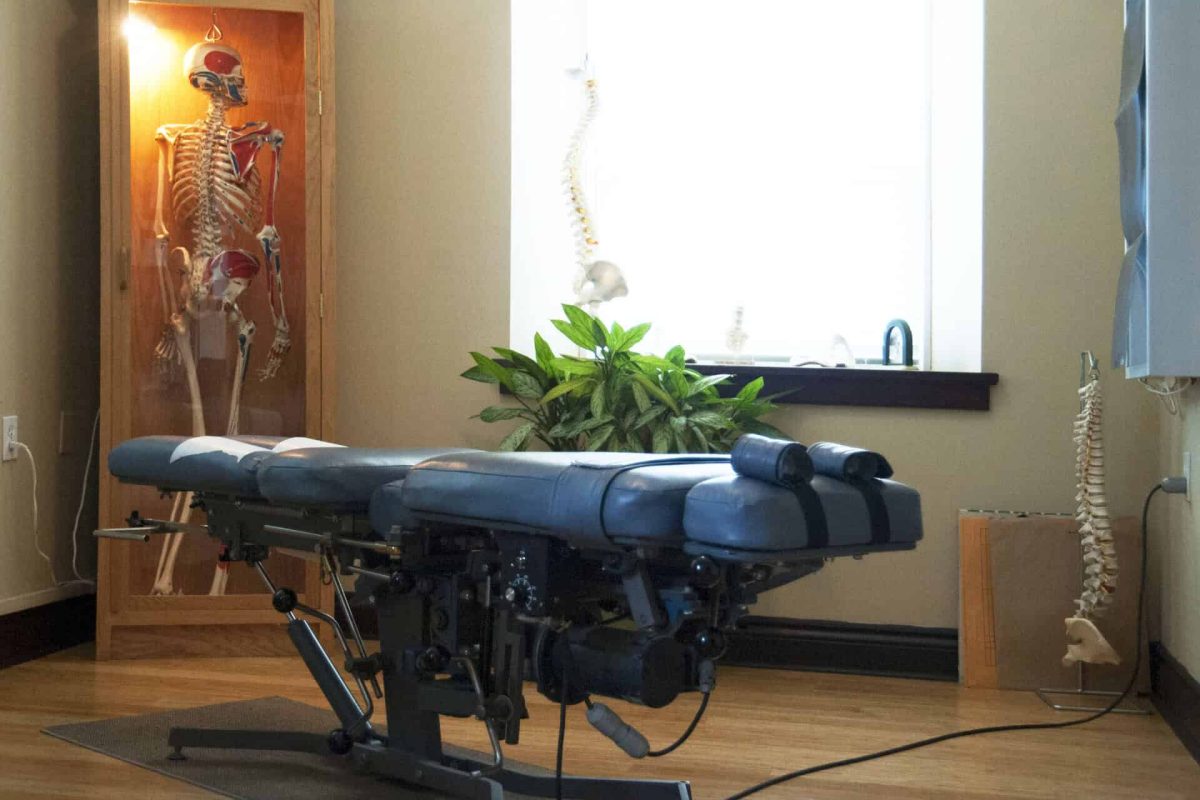 An assisted living and care home for seniors, modern building, a treatment couch and physiotherapy room.